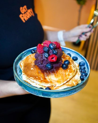 Pancakes topped with berries