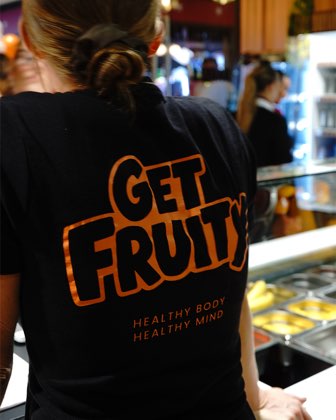 One of our team at work in a Get Fruity shirt